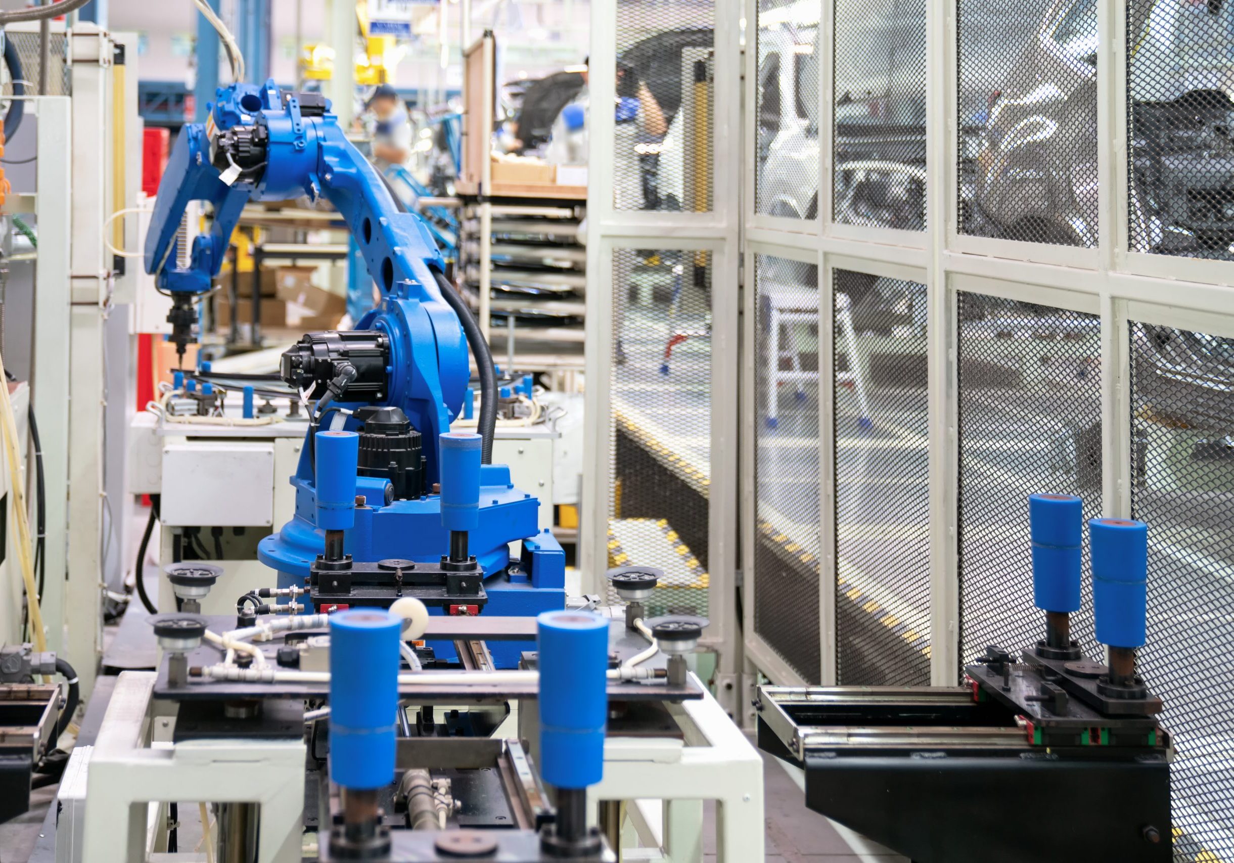 Automatic robot glass sealing in smart manufacturing factory 4.0 in the process of car manufacturing.Automation robotic arm working in operation machine zone in factory, Robot using in industrial manufacturing .